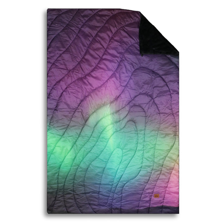 Aurora Ultralight Puffy Blanket in Aurora – Chilly Moose – Flat overhead view showing gradient #colour_aurora