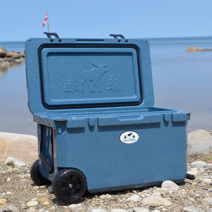 Open Box 55L Wheeled Explorer in Great Lakes – Chilly Moose – lid open on beach 
