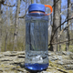 Clearwater Canteen 50oz in Lake – Chilly Moose – lifestyle on rock outcrop #colour_lake