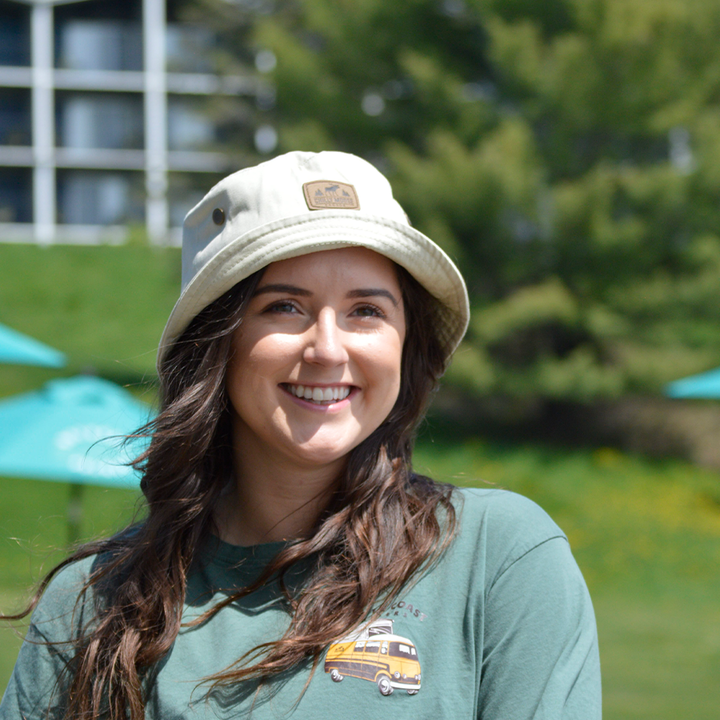 Harbour Hat – Chilly Moose – Beige bucket hat worn outdoors, front view on model #colour_sand-beige
