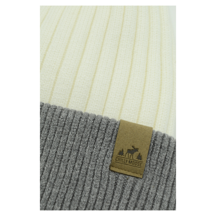 Ski Bunny Toque in White/Grey – Chilly Moose – Close-up of tan leather logo patch on grey cuff #colour_white