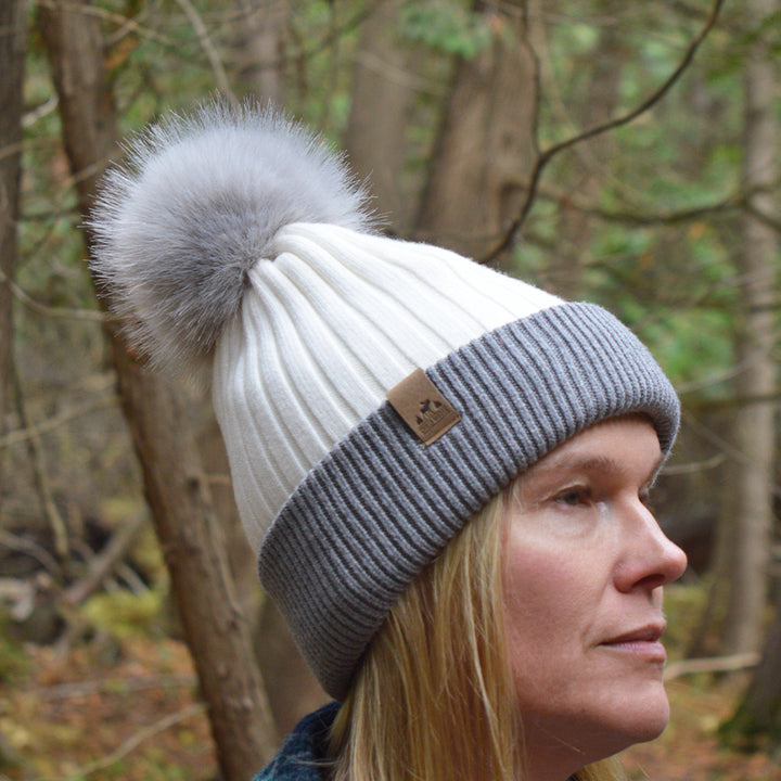 Ski Bunny Toque in White/Grey – Chilly Moose – Modeled in forest, profile showing pom-pom #colour_white
