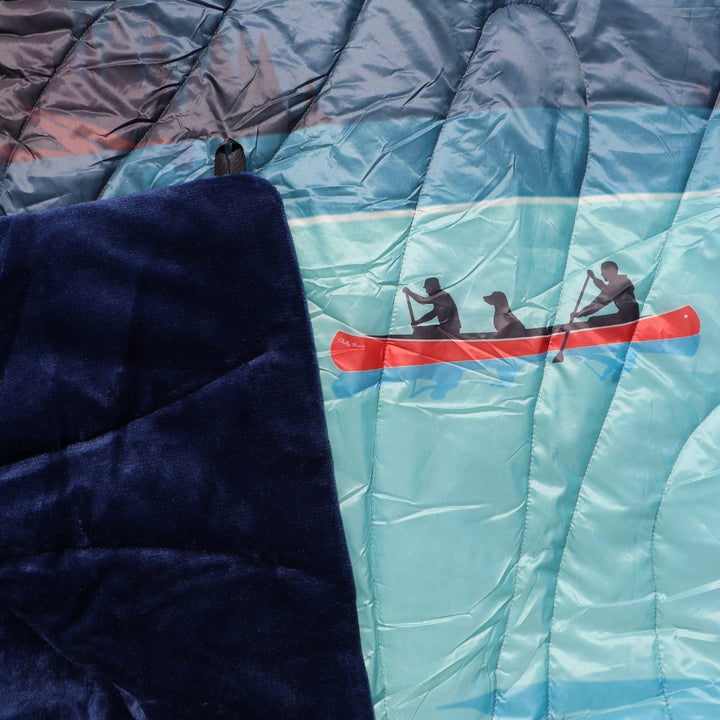 Stillwater Ultralight Puffy Blanket – Chilly Moose – Detail of quilted water pattern on navy side #colour_navy