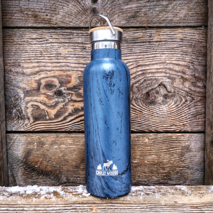 25oz Ontario Parks Turtle Bottle – Chilly Moose – Blue wood grain on rustic wood shelf with snow #colour_blue
